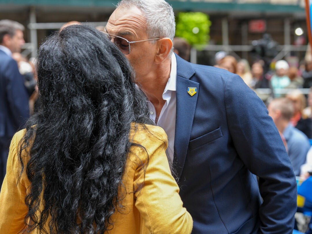 celebrity couple whispering